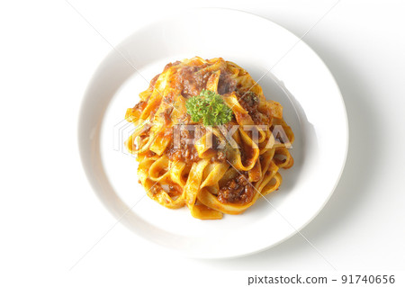 A bird's-eye view of the hot Bolognese, which is often entwined with flat pasta fitcine and tomato sauce, on a white background. A bird's-eye view of the hot Bolognese, which is often entwined with flat pasta fitcine and tomato sauce, on a white background. 91740656
