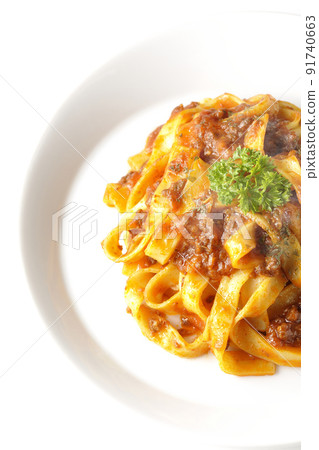 A bird's-eye view of the hot Bolognese, which is often entwined with flat pasta fitcine and tomato sauce, on a white background. A bird's-eye view of the hot Bolognese, which is often entwined with flat pasta fitcine and tomato sauce, on a white background. 91740663