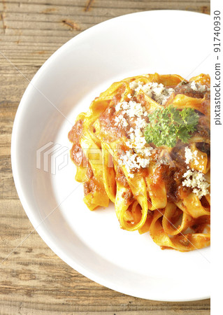 A bird's-eye view of Parmesan cheese on Bolognese, which is often entwined with flat pasta fitcine and tomato sauce. A bird's-eye view of Parmesan cheese on Bolognese, which is often entwined with flat pasta fitcine and tomato sauce. 91740930