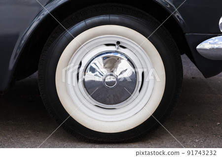 Closeup photo of white wheel of a car 91743232