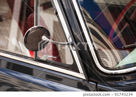 Side rearview mirror in round chromed frame, old car Side rearview mirror in round chromed frame, old car 91743234