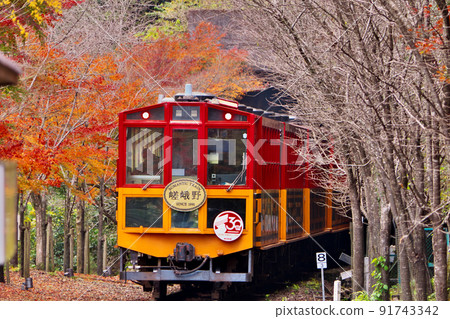 Sagano Sightseeing Railway trolley train departing from trolley Hozukyo station enters the tunnel toward Arashiyama 91743342