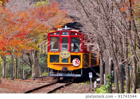 Sagano Sightseeing Railway trolley train departing from trolley Hozukyo station enters the tunnel toward Arashiyama 91743344