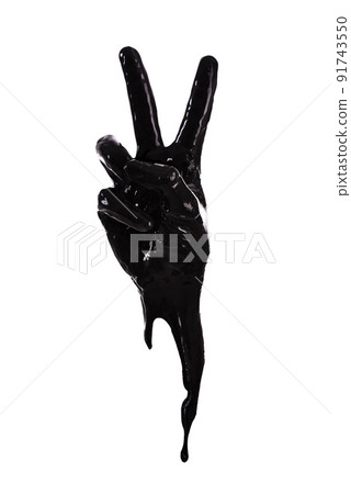 Peace out. Black paint outlining a hand making a peace sign. 91743550