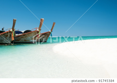 Shot of a boat docked on the shore on a beach in Phuket Thailand 91745384
