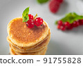 Food for breakfast healthy eating. Pancakes without butter with berries. Food for vegetarians and for dieting. American Pancakes Mini. Mini pancakes with blueberries and raspberries. American 91755828
