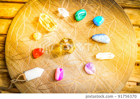 Healing crystals on brown background 91756370