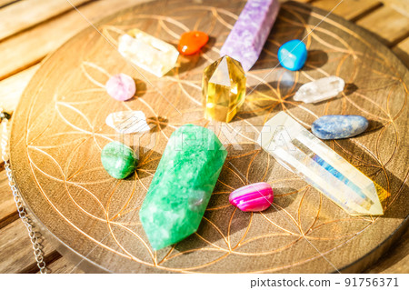 Healing crystals on brown background 91756371