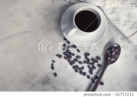 Cup of coffee and coffee beans background. Food and beverage concept. 91757215