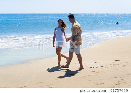 Happy young couple at the sea vacations Happy young couple at the sea vacations 91757629