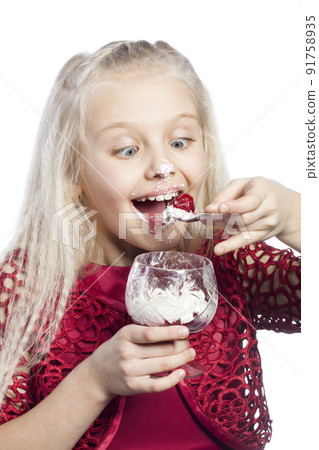 Beautiful blonde girl eating dessert Beautiful blonde girl eating dessert 91758935