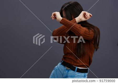 pretty woman fun brown sweater posing casual wear isolated background 91759000