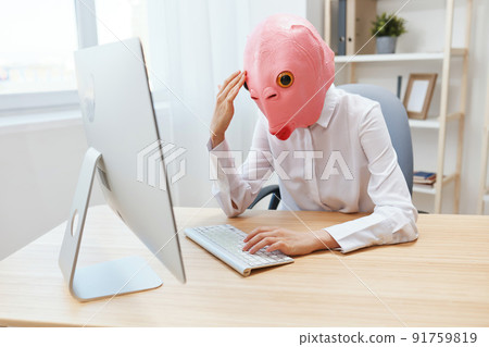 Frustrated crazy businesswoman worker freelancer in pink fish mask work on computer online pondering or making decision shocked by operational problems make facepalm in light modern office. Copy space Frustrated crazy businesswoman worker freelancer in pink fish mask work on computer online pondering or making decision shocked by operational problems make facepalm in light modern office. Copy space 91759819
