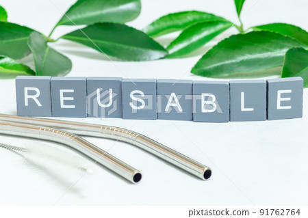 Reusable stainless steel straws and cleaning brush, wooden letters with word reusable, horizontal Reusable stainless steel straws and cleaning brush, wooden letters with word reusable, horizontal 91762764