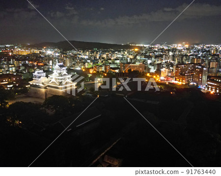 Illuminated telephoto aerial view of Kumamoto Castle 91763440