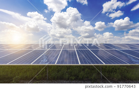 Solar panels with numerous solar modules and photovoltaic cells against blue sky with white clouds. 91770643