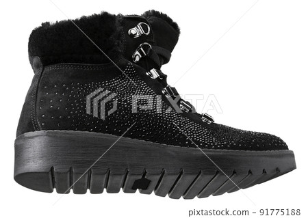 Women's black suede boot with a scattering of rhinestones, on a white background, bottom view 91775188