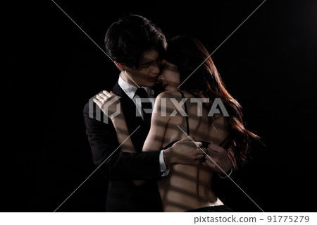 Young Couple embraces with love, business man try to untie lingeries bra of girlfriend 91775279