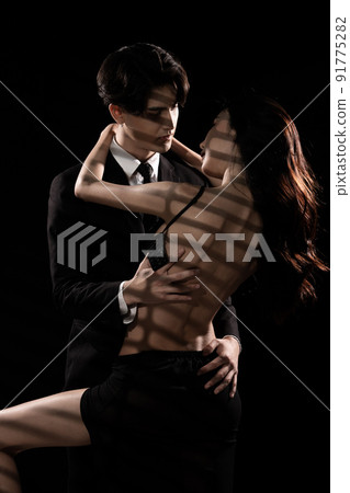 Young Couple embraces with love, business man try to untie lingeries bra of girlfriend 91775282