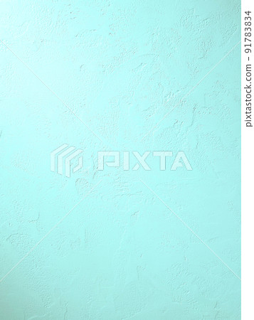 Vertical background image where light blue-green light hits the plastered wall with trowel marks 91783834