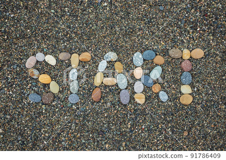 Start made from stones on sandy beach Start made from stones on sandy beach 91786409