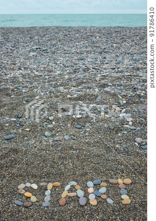 Start made from stones on sandy beach Start made from stones on sandy beach 91786410