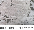 Old gray concrete wall with peeling surface. Grey concrete wall texture. 91786706