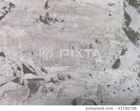 Old gray concrete wall with peeling surface. Grey concrete wall texture. Old gray concrete wall with peeling surface. Grey concrete wall texture. 91786706