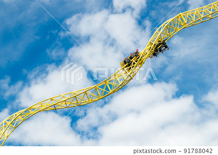 Ride roller coaster in motion in amusement park. 91788042