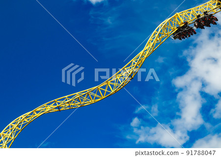 Ride roller coaster in motion in amusement park. 91788047