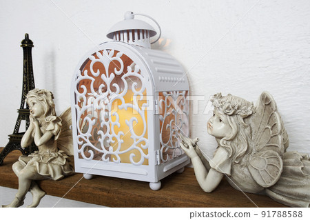 White lantern and Fairy statue Home decoration accessories on wooden shelves 91788588