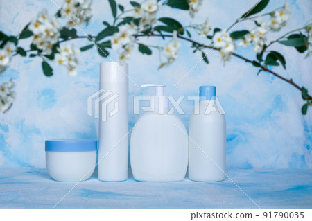 A set of white, plastic, containers. Packaging, bottle template for cosmetics, antiseptic, with detergents and chemical cleaners, for medical and cosmetic products. White and blue background with A set of white, plastic, containers. Packaging, bottle template for cosmetics, antiseptic, with detergents and chemical cleaners, for medical and cosmetic products. White and blue background with 91790035