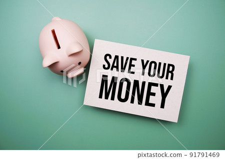 Save Your Money text message and piggy bank on green background Save Your Money text message and piggy bank on green background 91791469