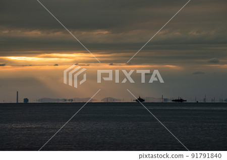 Wide seascape with orange sun set beam lighting. 91791840