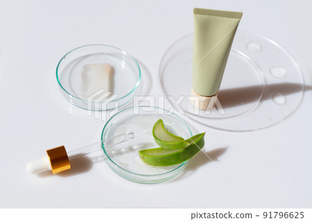 Glass petri dish with transparent pure serum for skin care 91796625
