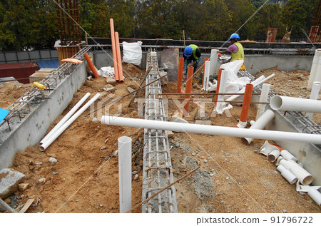SELANGOR, MALAYSIA -JUNE 5, 2022: Toilets underground sewerage pipes installed at construction sites before floor concrete is poured. Setting out the position opening is marked by the surveyor. SELANGOR, MALAYSIA -JUNE 5, 2022: Toilets underground sewerage pipes installed at construction sites before floor concrete is poured. Setting out the position opening is marked by the surveyor. 91796722
