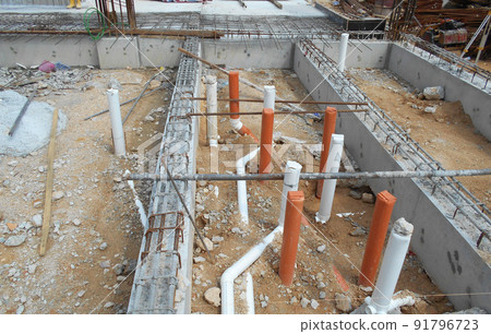 SELANGOR, MALAYSIA -JUNE 5, 2022: Toilets underground sewerage pipes installed at construction sites before floor concrete is poured. Setting out the position opening is marked by the surveyor. SELANGOR, MALAYSIA -JUNE 5, 2022: Toilets underground sewerage pipes installed at construction sites before floor concrete is poured. Setting out the position opening is marked by the surveyor. 91796723