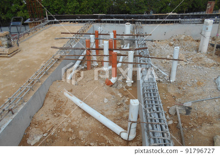 SELANGOR, MALAYSIA -JUNE 5, 2022: Toilets underground sewerage pipes installed at construction sites before floor concrete is poured. Setting out the position opening is marked by the surveyor. SELANGOR, MALAYSIA -JUNE 5, 2022: Toilets underground sewerage pipes installed at construction sites before floor concrete is poured. Setting out the position opening is marked by the surveyor. 91796727