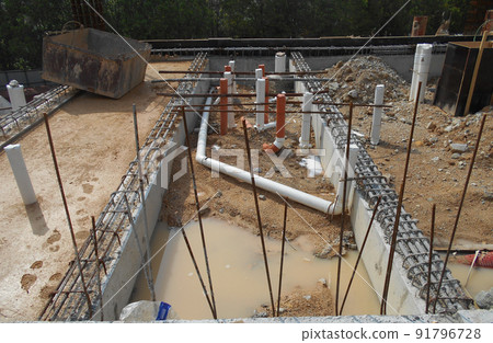 SELANGOR, MALAYSIA -JUNE 5, 2022: Toilets underground sewerage pipes installed at construction sites before floor concrete is poured. Setting out the position opening is marked by the surveyor. 91796728