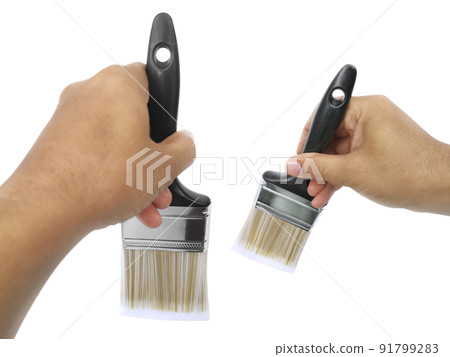 hand holding Paintbrush isolated on white background hand holding Paintbrush isolated on white background 91799283