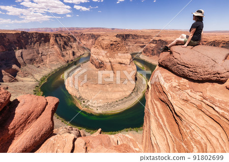 Adventurous Caucasian Woman at Horseshoe Bend in Page, Arizona, United States. 91802699