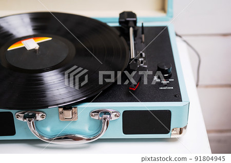 Analog vinyl record player with disc. Modern turntable audio equipment, close up. Analog vinyl record player with disc. Modern turntable audio equipment, close up. 91804945