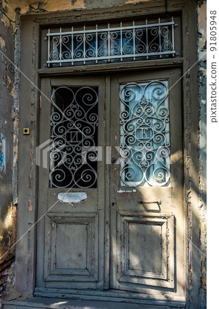 Old door with carving in Tbilisi 91805948