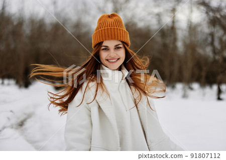 woman in winter clothes in a hat fun winter landscape Lifestyle woman in winter clothes in a hat fun winter landscape Lifestyle 91807112