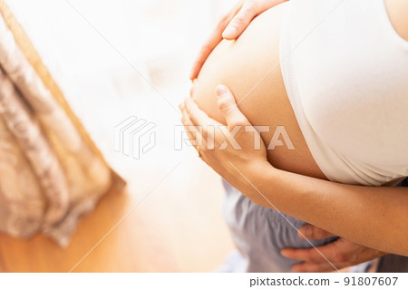 Pregnant belly hands. Happy pregnancy woman and husband hugging pregnant belly. Concept maternity, pregnancy, childbirth. 91807607