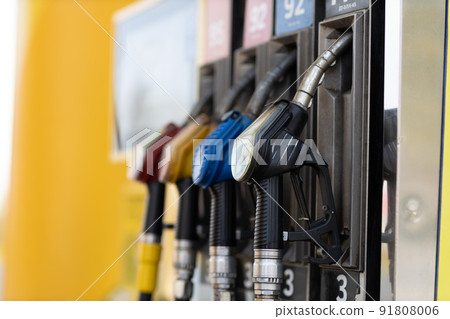 Close up filling gun in his hand at gas station. Sanctions economy crisis Close up filling gun in his hand at gas station. Sanctions economy crisis 91808006