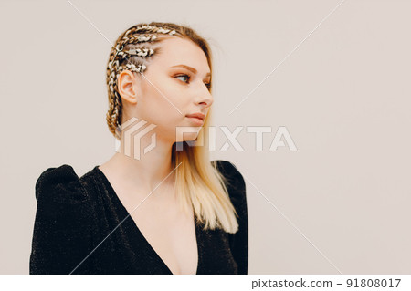 Portrait braided afro braids dreadlocks kanekalon pigtails hair of female client in barber salon. Portrait braided afro braids dreadlocks kanekalon pigtails hair of female client in barber salon. 91808017