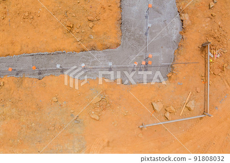 Strip foundation reinforcement frame for a reinforced concrete house structure in construction site Strip foundation reinforcement frame for a reinforced concrete house structure in construction site 91808032