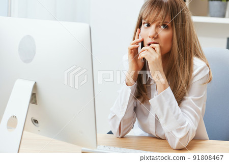 Nervous adorable blonde businesswoman worker freelancer made big mistake talking with client in call in light modern office. Unhappy employee work on computer online in support service. Copy space Nervous adorable blonde businesswoman worker freelancer made big mistake talking with client in call in light modern office. Unhappy employee work on computer online in support service. Copy space 91808467