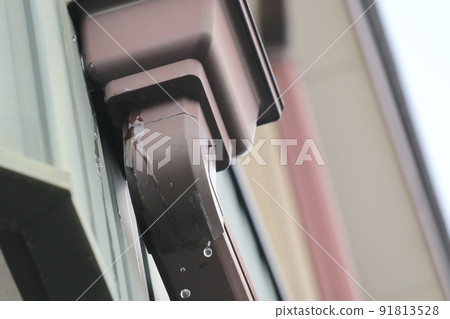 Image of water leaking from a gutter collector Image of water leaking from a gutter collector 91813528